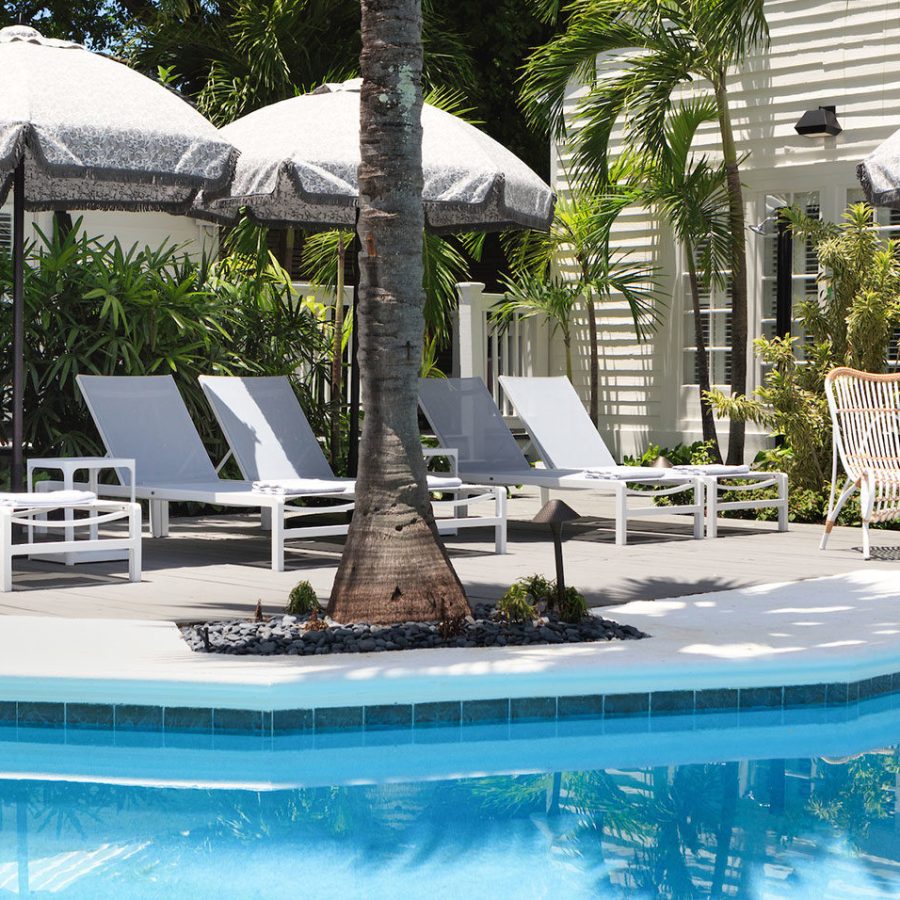 pool and chairs with umbrellas